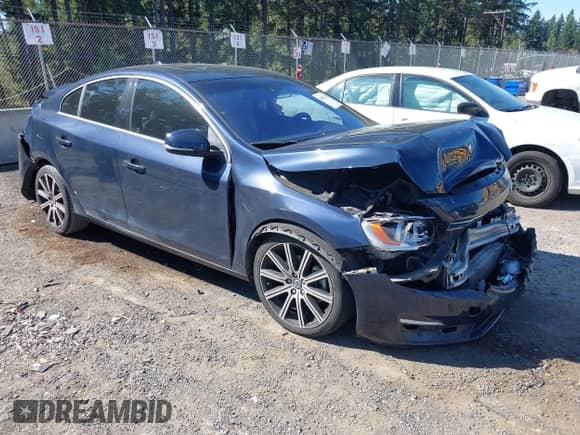 2015 Volvo S60 T5 Drive-E Premier with VIN YV126MFB5F1299795, listed as a IAAI auction lot 43052703 with 100,066 mi miles and . Bid and sale history available at DreamBid. Image 1.