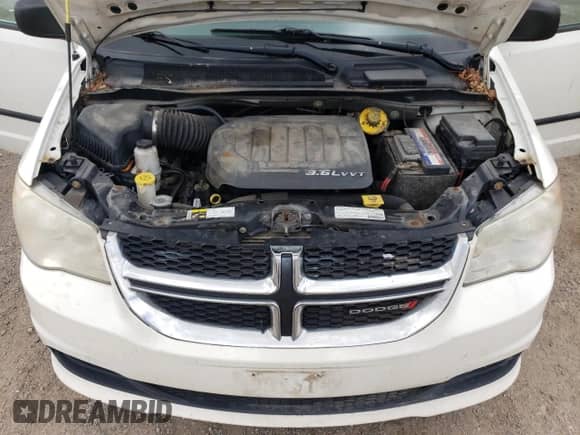 2013 Dodge Grand Caravan American Value with VIN 2C4RDGBG0DR692870, listed as a Copart auction lot 70938995 with 283,663 mi miles and Clean title. Bid and sale history available at DreamBid. Image 12.