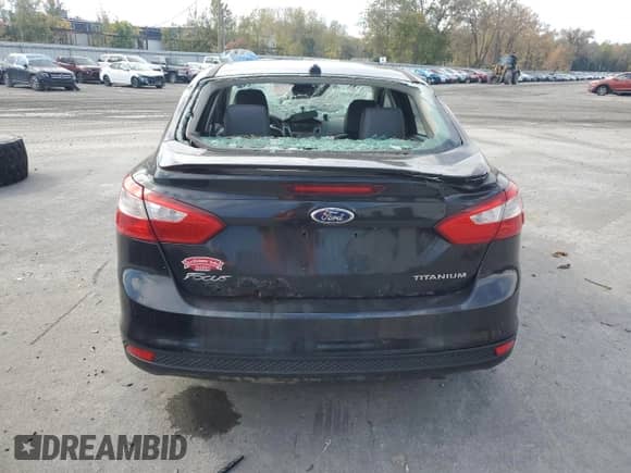 2014 Ford Focus Titanium with VIN 1FADP3J20EL243009, listed as a Copart auction lot 81947715 with Not provided miles and Salvage title. Bid and sale history available at DreamBid. Image 6.
