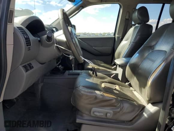 2006 Nissan Frontier SE with VIN 1N6AD07UX6C412495, listed as a Copart auction lot 84879235 with 257,704 mi miles and Salvage title. Bid and sale history available at DreamBid. Image 7.