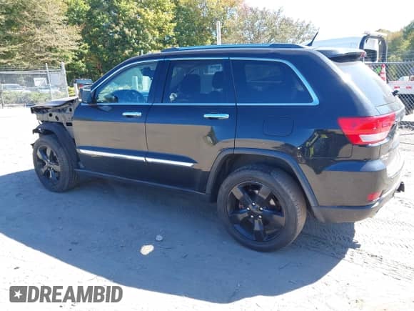 2013 Jeep Grand Cherokee Limited z VIN 1C4RJFBT8DC657129, wystawiony jako IAAI lot #43372561 z przebiegiem 157 836 mil mil oraz . Historia ofert i sprzedaży dostępna na DreamBid. Obrazek 15.