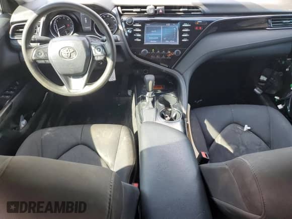 2019 Toyota Camry LE с VIN 4T1B11HK6KU842124, выставлен на аукционе Copart как лот 83793575 с пробегом 194 095 миль миль и Списание • Salvage title. История ставок и продаж доступна на DreamBid. Изображение 8.