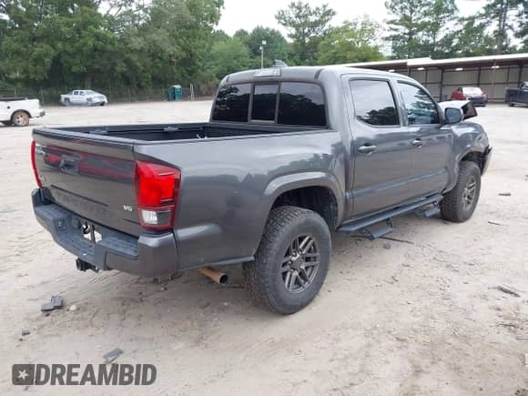 2020 Toyota Tacoma SR with VIN 3TMCZ5AN4LM314973, listed as a IAAI auction lot 42955800 with 94,693 mi miles and . Bid and sale history available at DreamBid. Image 4.