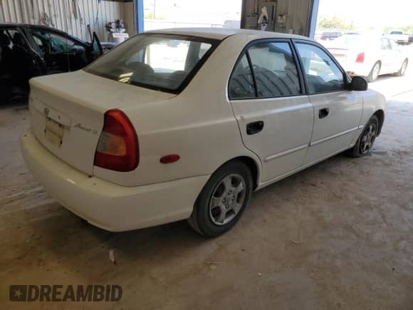 2002 Hyundai Accent GL с VIN KMHCG45C82U380280, выставлен на аукционе Copart как лот 79087254 с пробегом 173 764 миль миль и Чистый • Clean title. История ставок и продаж доступна на DreamBid. Изображение 3.