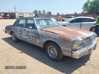 1985 Chevrolet Caprice Classic Brougham с VIN 1G1BN69Z6FY185317, выставлен на аукционе IAAI как лот 42032298 с пробегом 4 311 миль миль и . История ставок и продаж доступна на DreamBid. Изображение 1.