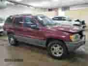 2002 Jeep Grand Cherokee Sport with VIN 1J4GW38S52C272382, listed as a Copart auction lot 65164915 with 248,964 mi miles and Clean title. Bid and sale history available at DreamBid. Image 4.