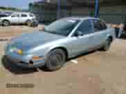 2002 Saturn SL with VIN 1G8ZH52852Z125665, listed as a Copart auction lot 64182705 with 167,641 mi miles and Salvage title. Bid and sale history available at DreamBid. Image 1.