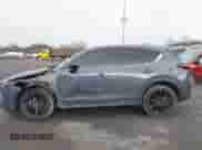 2022 Mazda CX-5 S Carbon Edition z VIN JM3KFBCM9N1538707, wystawiony jako IAAI lot #42026877 z przebiegiem 36 077 mil mil oraz . Historia ofert i sprzedaży dostępna na DreamBid. Obrazek 14.