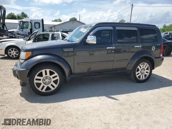 2010 Dodge Nitro Heat with VIN 1D4PU4GK2AW174333, listed as a Copart auction lot 62385005 with 99,307 mi miles and Salvage title. Bid and sale history available at DreamBid. Image 1.
