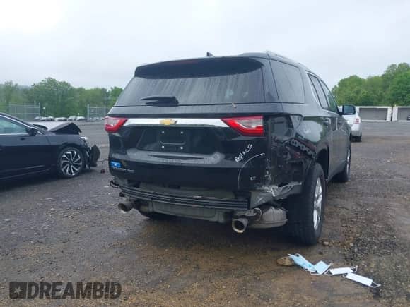 2018 Chevrolet Traverse LT Cloth z VIN 1GNEVGKW0JJ275663, wystawiony jako IAAI lot #42224038 z przebiegiem 115 995 mil mil oraz . Historia ofert i sprzedaży dostępna na DreamBid. Obrazek 6.