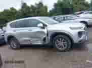 2019 Hyundai Santa Fe SE z VIN 5NMS23AD0KH011086, wystawiony jako IAAI lot #43300514 z przebiegiem 109 476 mil mil oraz . Historia ofert i sprzedaży dostępna na DreamBid. Obrazek 13.