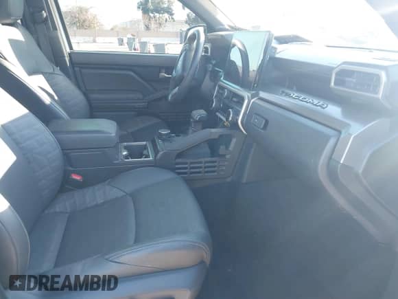 2024 Toyota Tacoma SR5 with VIN 3TMLB5JN8RM034034, listed as a IAAI auction lot 41253779 with 21,448 mi miles and . Bid and sale history available at DreamBid. Image 5.