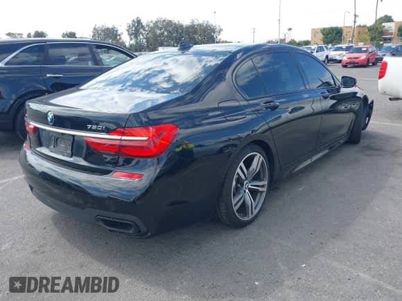 2016 BMW 7 Series 750i xDrive with VIN WBA7F2C5XGG415731, listed as a IAAI auction lot 43302211 with 113,001 mi miles and . Bid and sale history available at DreamBid. Image 4.
