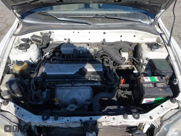 2002 Hyundai Accent GL z VIN KMHCG45C42U375352, wystawiony jako IAAI lot #42699297 z przebiegiem 103 540 mil mil oraz . Historia ofert i sprzedaży dostępna na DreamBid. Obrazek 10.