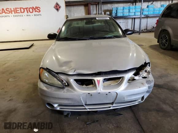 2003 Pontiac Grand Am SE1 with VIN 1G2NF52E13M550724, listed as a Copart auction lot 56990665 with 214,603 mi miles and Salvage title. Bid and sale history available at DreamBid. Image 5.