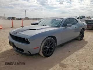 2020 Dodge Challenger SXT with VIN 2C3CDZAG3LH218990, listed as a Copart auction lot 81957265 with 59,129 mi miles and Salvage title. Bid and sale history available at DreamBid. Image 1.