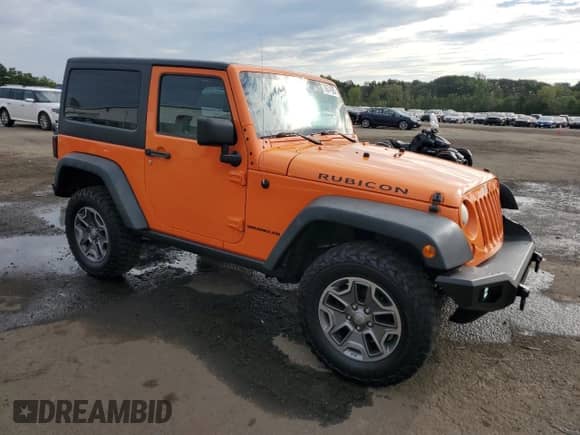 2013 Jeep Wrangler Rubicon 10th Anniversary with VIN 1C4BJWCG0DL509141, listed as a Copart auction lot 70674925 with 118,224 mi miles and Salvage title. Bid and sale history available at DreamBid. Image 4.