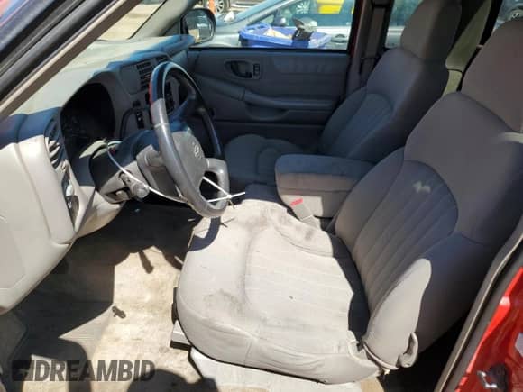 2003 Chevrolet S-10 LS with VIN 1GCCS19X038191048, listed as a Copart auction lot 80164935 with 103,558 mi miles and Salvage title. Bid and sale history available at DreamBid. Image 7.