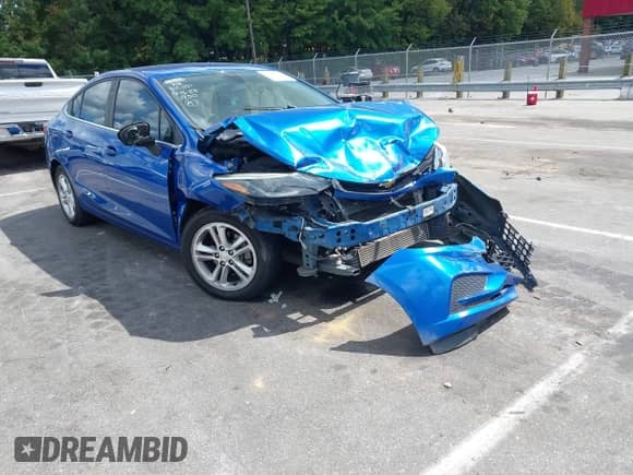 2017 Chevrolet Cruze LT z VIN 1G1BE5SM6H7251950, wystawiony jako IAAI lot #43245442 z przebiegiem 142 905 mil mil oraz . Historia ofert i sprzedaży dostępna na DreamBid. Obrazek 1.