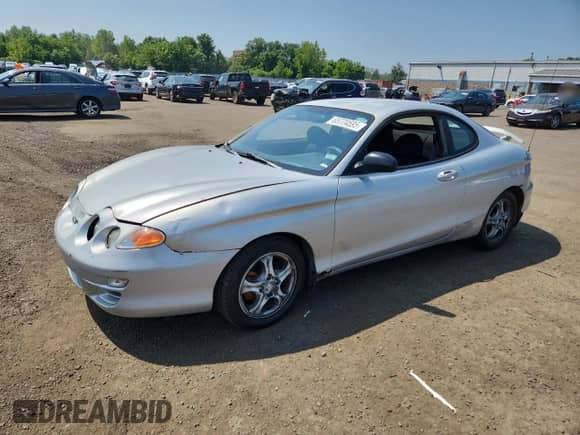 2001 Hyundai Tiburon с VIN KMHJG25FX1U237982, выставлен на аукционе Copart как лот 65774595 с пробегом 125 241 миль миль и Списание • Salvage title. История ставок и продаж доступна на DreamBid. Изображение 1.