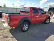 2009 Nissan Frontier SE with VIN 1N6AD07W59C425693, listed as a Copart auction lot 69923245 with 124,476 mi miles and Salvage title. Bid and sale history available at DreamBid. Image 3.