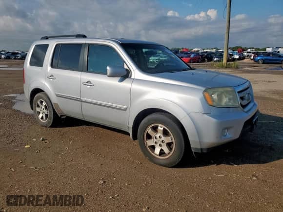 2011 Honda Pilot Touring z VIN 5FNYF3H97BB017646, wystawiony jako Copart lot #70779255 z przebiegiem 219 787 mil mil oraz Czysty tytuł • Clean title. Historia ofert i sprzedaży dostępna na DreamBid. Obrazek 4.