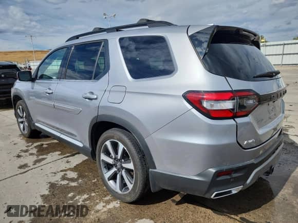 2023 Honda Pilot Touring с VIN 5FNYG1H70PB012750, выставлен на аукционе Copart как лот 71878875 с пробегом 26 304 миль миль и Списание • Salvage title. История ставок и продаж доступна на DreamBid. Изображение 2.