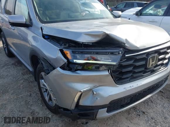 2024 Honda Pilot EX-L with VIN 5FNYG2H59RB010020, listed as a IAAI auction lot 41808244 with 21,400 mi miles and . Bid and sale history available at DreamBid. Image 6.