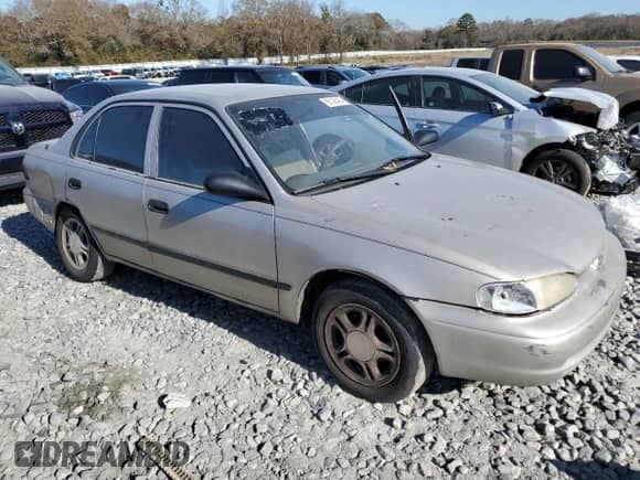 2000 Chevrolet Prizm z VIN 1Y1SK5284YZ407566, wystawiony jako Copart lot #86148464 z przebiegiem 193 844 mil mil oraz Szkoda całkowita • Salvage title. Historia ofert i sprzedaży dostępna na DreamBid. Obrazek 4.