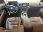 2016 Jeep Grand Cherokee Summit with VIN 1C4RJFJT7GC389650, listed as a Copart auction lot 52432435 with 47,997 mi miles and Salvage title. Bid and sale history available at DreamBid. Image 8.