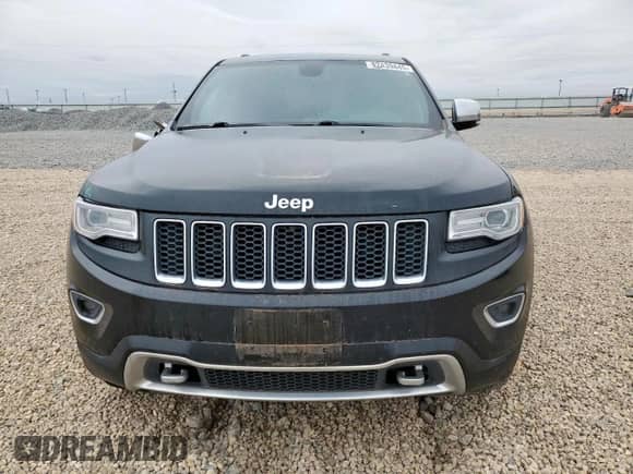 2015 Jeep Grand Cherokee Overland with VIN 1C4RJFCG7FC229492, listed as a Copart auction lot 82439445 with 104,257 mi miles and Salvage title. Bid and sale history available at DreamBid. Image 5.