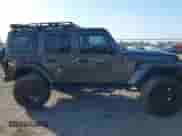 2021 Jeep Wrangler Unlimited Sahara High Altitude with VIN 1C4HJXEM8MW670290, listed as a IAAI auction lot 41547689 with 21,862 mi miles and . Bid and sale history available at DreamBid. Image 13.