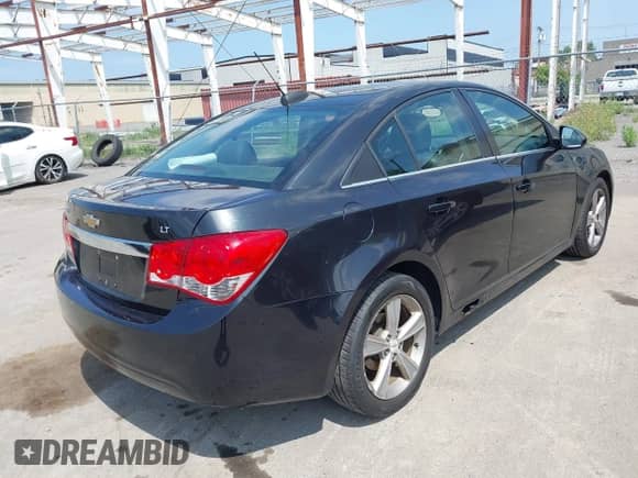 2015 Chevrolet Cruze LT with VIN 1G1PE5SB8F7197603, listed as a IAAI auction lot 42978654 with 246,215 mi miles and . Bid and sale history available at DreamBid. Image 4.