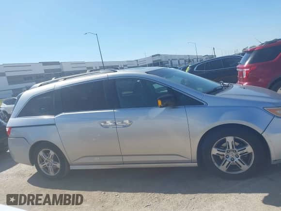 2012 Honda Odyssey Touring с VIN 5FNRL5H95CB122101, выставлен на аукционе IAAI как лот 43489117 с пробегом 154 148 миль миль и . История ставок и продаж доступна на DreamBid. Изображение 13.