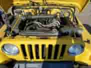 2004 Jeep Wrangler Sport z VIN 1J4FA49S14P708543, wystawiony jako Copart lot #82703525 z przebiegiem 197 964 mil mil oraz Czysty tytuł • Clean title. Historia ofert i sprzedaży dostępna na DreamBid. Obrazek 11.