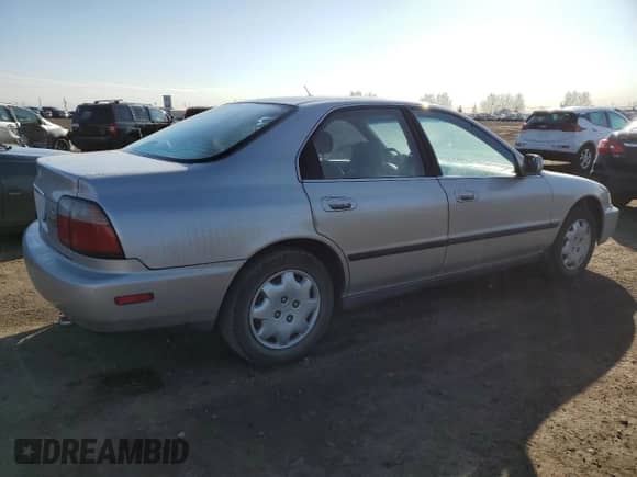 1997 Honda Accord LX with VIN 1HGCD5630VA809341, listed as a Copart auction lot 54182105 with 223,707 mi miles and Salvage title. Bid and sale history available at DreamBid. Image 3.