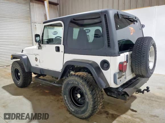 2001 Jeep Wrangler Sahara z VIN 1J4FA59S41P303519, wystawiony jako Copart lot #59899545 z przebiegiem 238 151 mil mil oraz Czysty tytuł • Clean title. Historia ofert i sprzedaży dostępna na DreamBid. Obrazek 2.