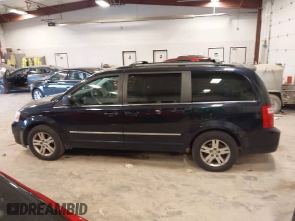 2010 Dodge Grand Caravan SXT with VIN 2D4RN5DXXAR252457, listed as a IAAI auction lot 43175672 with 103,944 mi miles and . Bid and sale history available at DreamBid. Image 14.