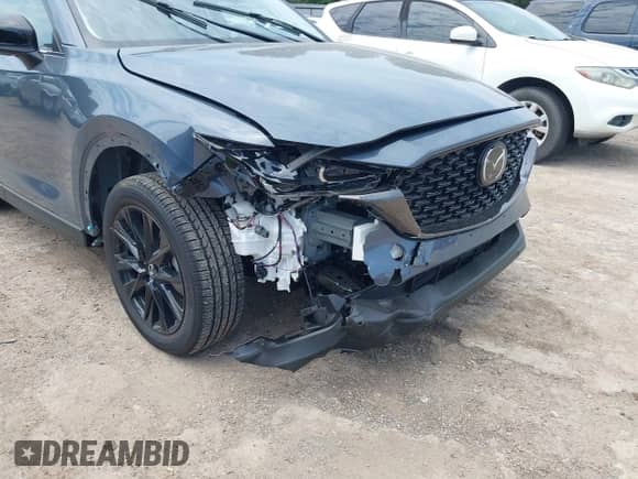 2025 Mazda CX-5 S Carbon Edition z VIN JM3KFBCM5S0702469, wystawiony jako IAAI lot #43076943 z przebiegiem 725 mil mil oraz . Historia ofert i sprzedaży dostępna na DreamBid. Obrazek 6.