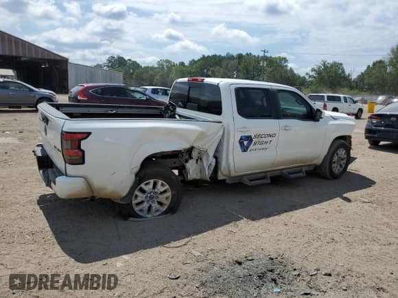 2023 Nissan Frontier SV with VIN 1N6ED1FK1PN659143, listed as a Copart auction lot 60690044 with 13,706 mi miles and Salvage title. Bid and sale history available at DreamBid. Image 3.