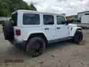 2022 Jeep Wrangler Unlimited Sahara with VIN 1C4JJXP69NW223291, listed as a Copart auction lot 64458055 with 24,574 mi miles and Salvage title. Bid and sale history available at DreamBid. Image 3.
