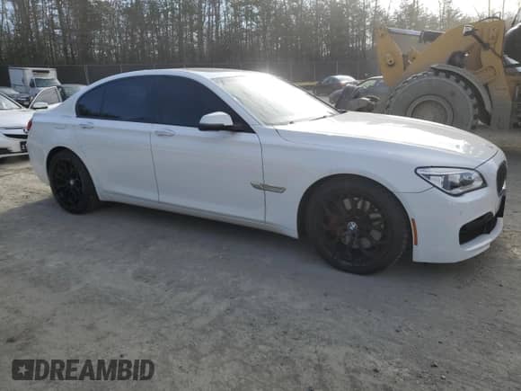 2015 BMW 7 Series 750i xDrive with VIN WBAYB6C50FD225492, listed as a Copart auction lot 50018225 with 76,059 mi miles and Salvage title. Bid and sale history available at DreamBid. Image 4.