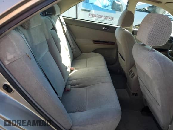 2003 Toyota Camry LE z VIN 4T1BE32K83U144057, wystawiony jako Copart lot #86856195 z przebiegiem 125 397 mil mil oraz Szkoda całkowita • Salvage title. Historia ofert i sprzedaży dostępna na DreamBid. Obrazek 10.