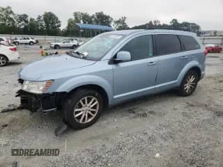 2013 Dodge Journey SXT with VIN 3C4PDCBG4DT581381, listed as a Copart auction lot 69137535 with 155,977 mi miles and Salvage title. Bid and sale history available at DreamBid. Image 1.