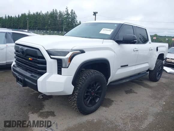 2024 Toyota Tundra SR5 with VIN 5TFLA5EC0RX034986, listed as a IAAI auction lot 42391946 with 8,679 mi miles and . Bid and sale history available at DreamBid. Image 2.