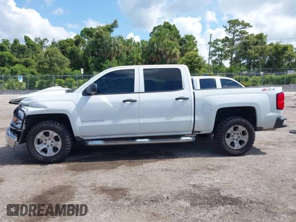 2014 Chevrolet Silverado 1500 LT z VIN 3GCUKREC6EG165041, wystawiony jako IAAI lot #42588499 z przebiegiem 189 554 mil mil oraz . Historia ofert i sprzedaży dostępna na DreamBid. Obrazek 14.
