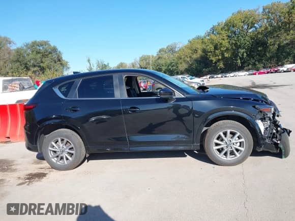 2025 Mazda CX-5 S Select z VIN JM3KFBBLXS0589143, wystawiony jako IAAI lot #43401475 z przebiegiem 24 004 mil mil oraz . Historia ofert i sprzedaży dostępna na DreamBid. Obrazek 13.