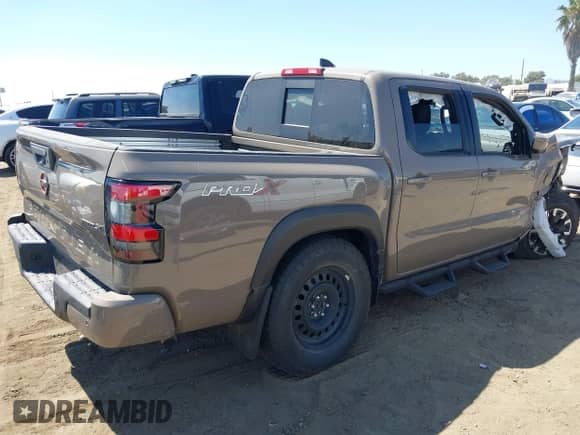 2023 Nissan Frontier Pro-X with VIN 1N6ED1EJ1PN615328, listed as a IAAI auction lot 39972686 with 15,981 mi miles and . Bid and sale history available at DreamBid. Image 4.