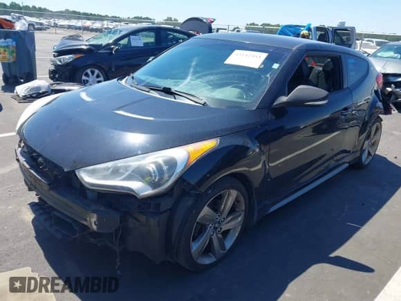 2013 Hyundai Veloster Turbo с VIN KMHTC6AE3DU152799, выставлен на аукционе IAAI как лот 43142353 с пробегом 121 931 миль миль и . История ставок и продаж доступна на DreamBid. Изображение 2.