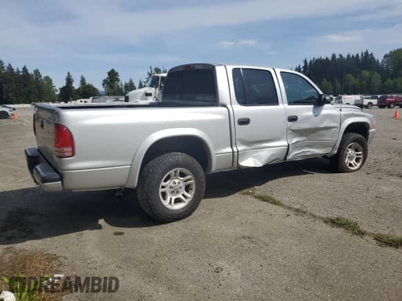 2003 Dodge Dakota Sport с VIN 1D7HG38N23S309001, выставлен на аукционе Copart как лот 56595945 с пробегом 130 864 миль миль и Списание • Salvage title. История ставок и продаж доступна на DreamBid. Изображение 3.